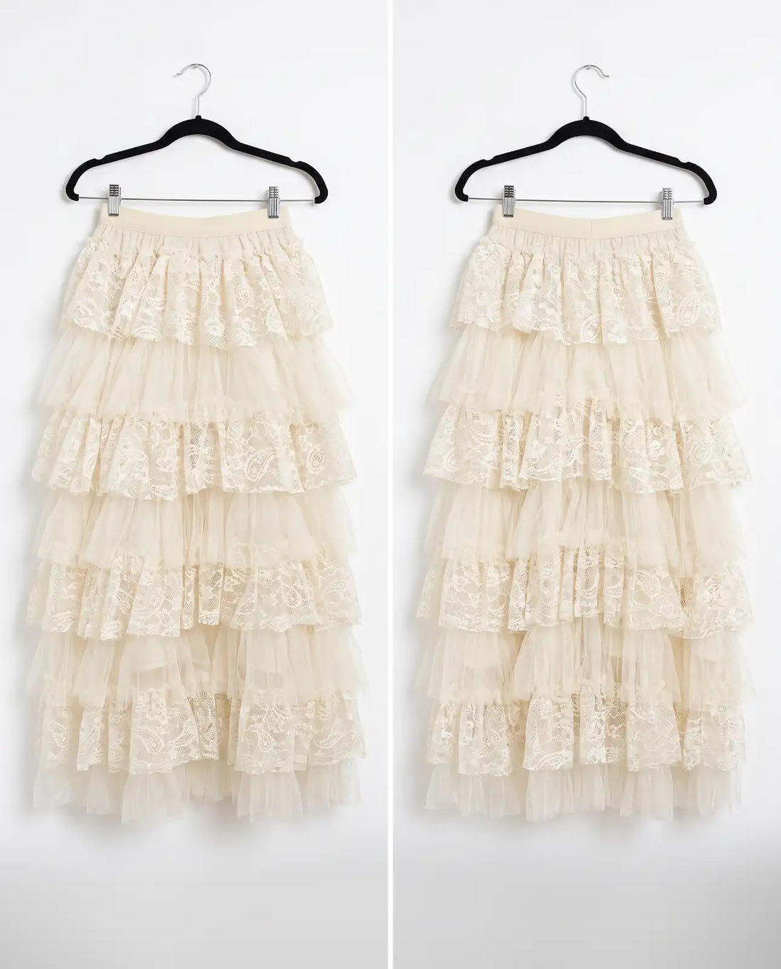 A black tiered tulle skirt with lace trim, shown from the front and back on black hangers against a white background.