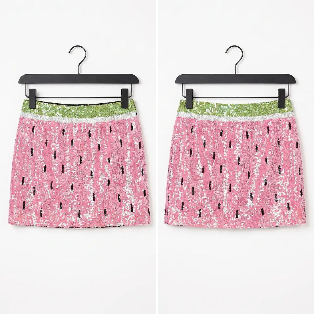 Two pink sequined mini skirts with a watermelon print pattern, hanging on black hangers against a white background.